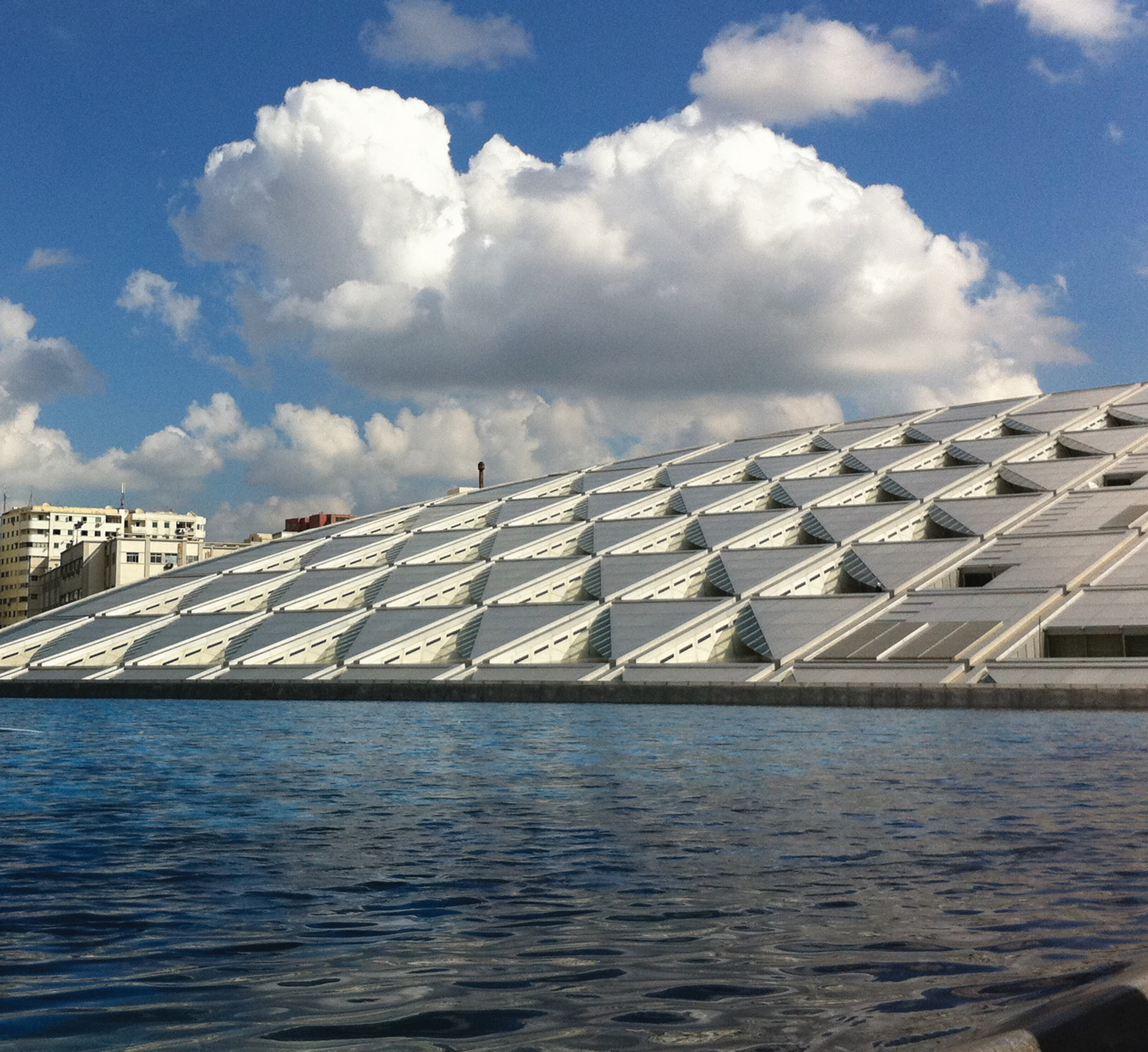 The Mediterranean-facing side of the Library of Alexandria in Egypt. Image by Joakim Jardenberg via Flickr.